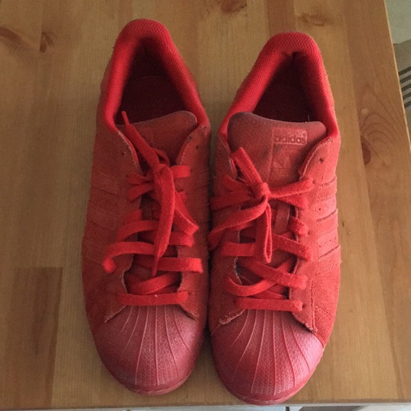 red adidas shell toe shoes